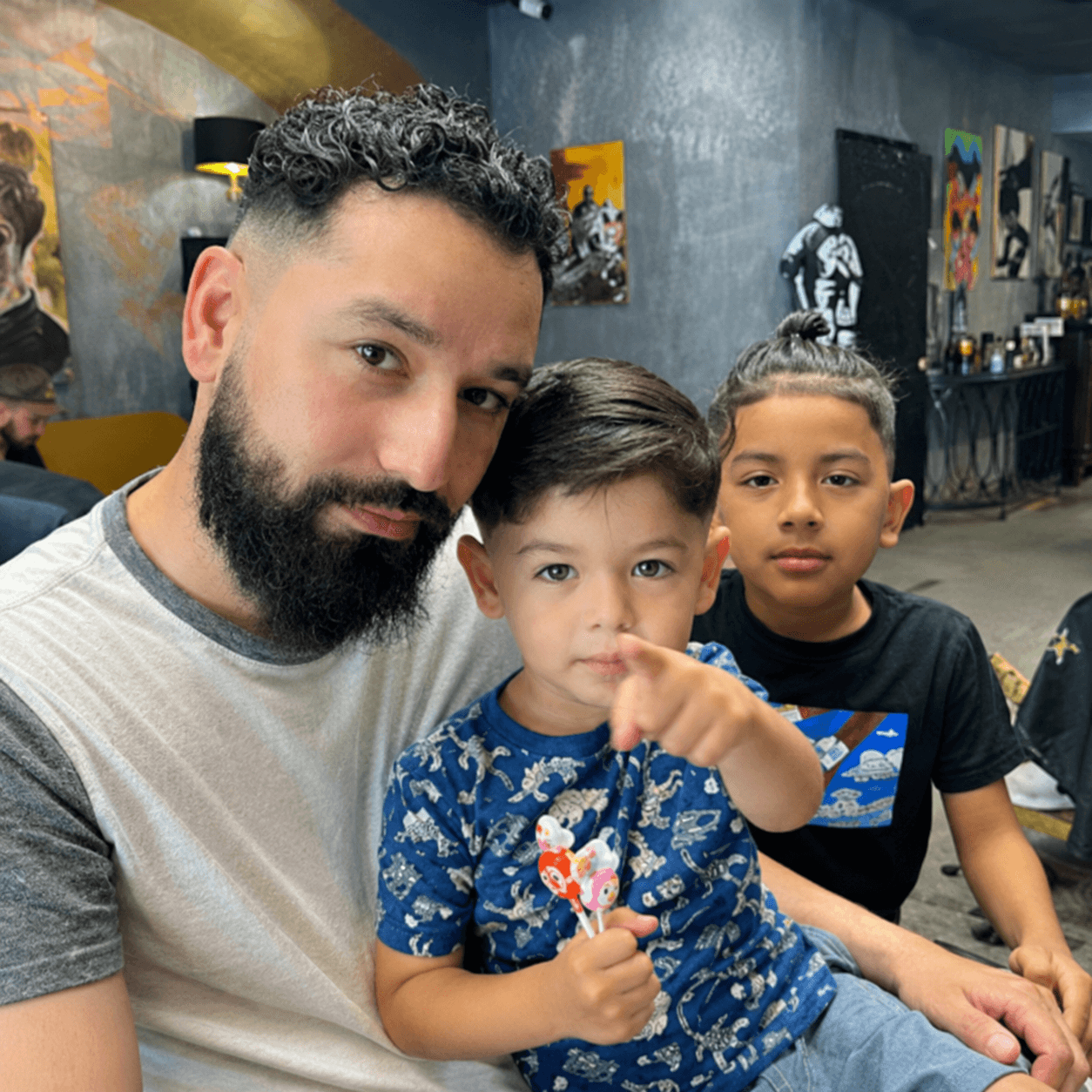 Family getting haircuts together at the shop